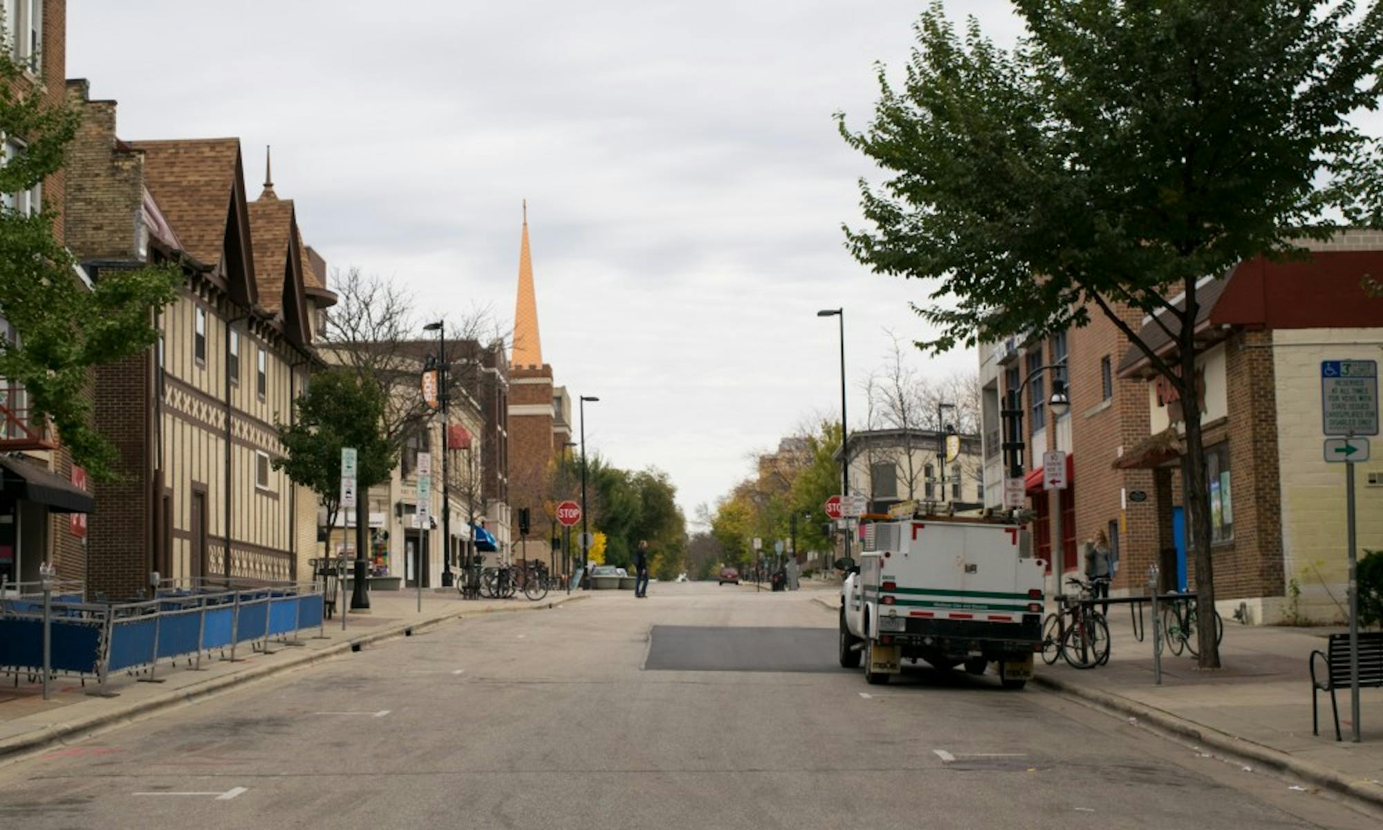 A naked, unconscious woman was found in a car on West Gilman Street Friday night.