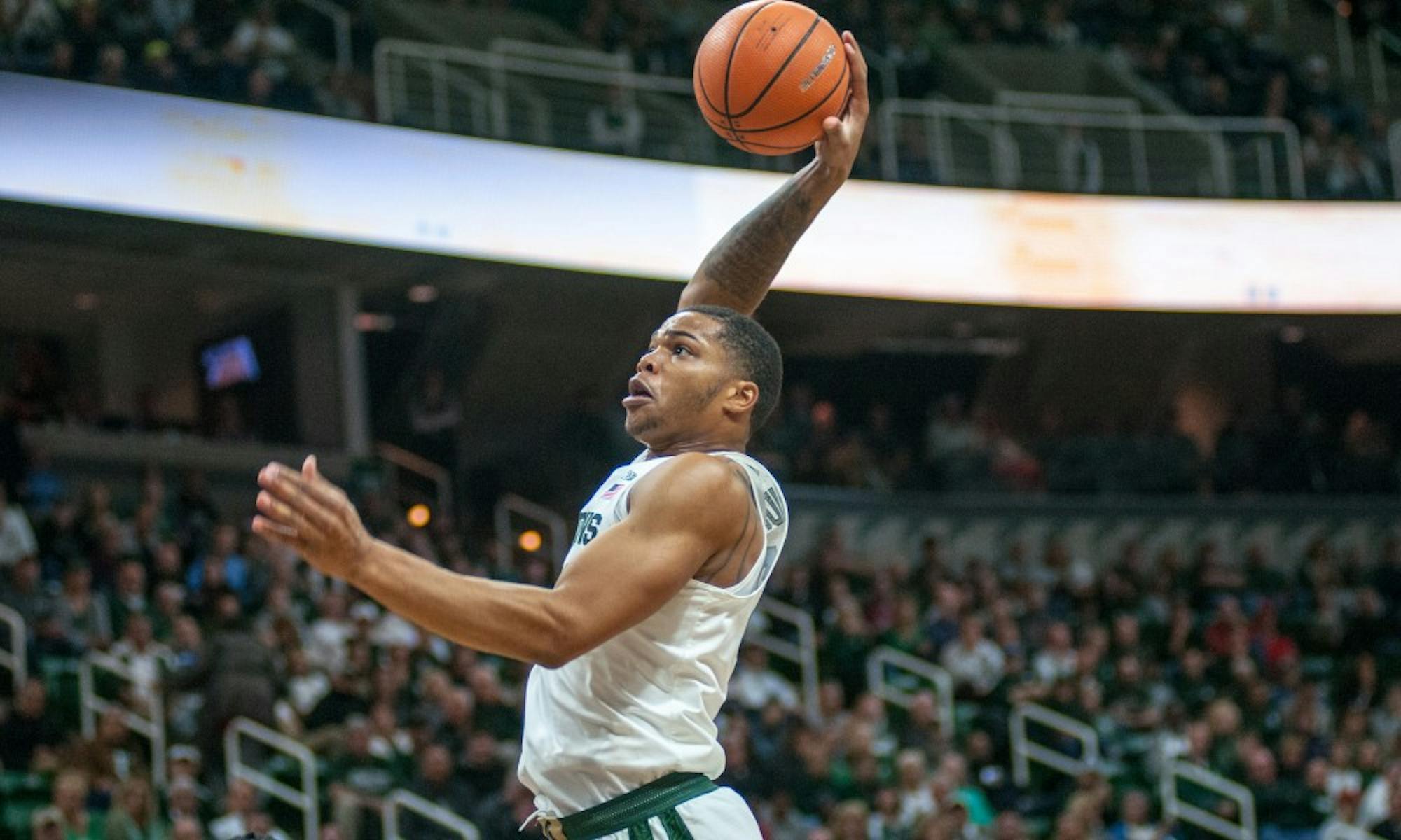 Sophomore forward Miles Bridges (22) dunks the basketball during the game against Ferris State on Oct. 26, 2017, at the Breslin Center. The Spartans defeated the Bulldogs, 80-72.