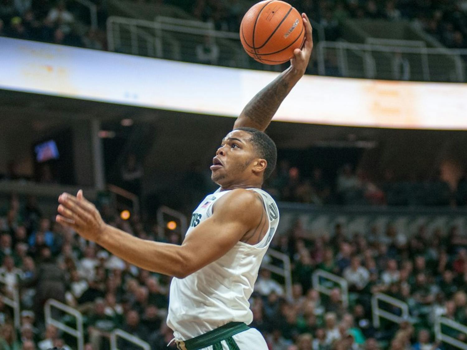 Sophomore forward Miles Bridges (22) dunks the basketball during the game against Ferris State on Oct. 26, 2017, at the Breslin Center. The Spartans defeated the Bulldogs, 80-72.