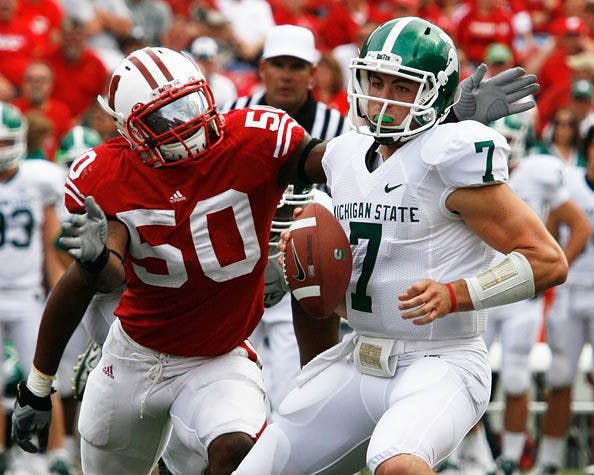 The Spartans defense looks to stifle the Badgers’ running game.