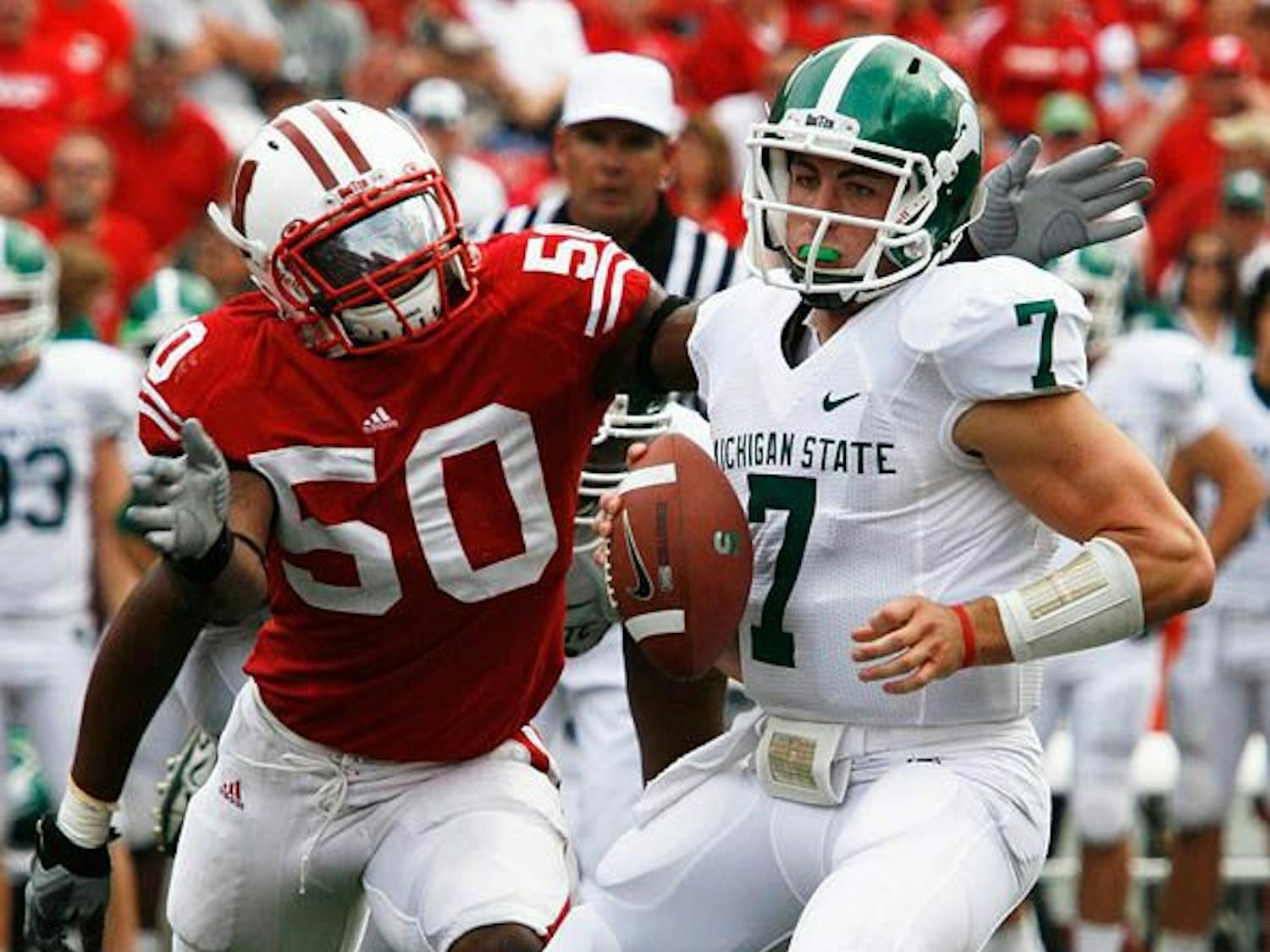 The Spartans defense looks to stifle the Badgers’ running game.