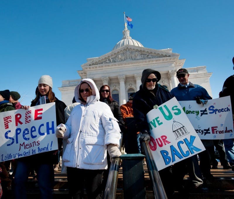 Protesters rally against uncapped corporate election spending