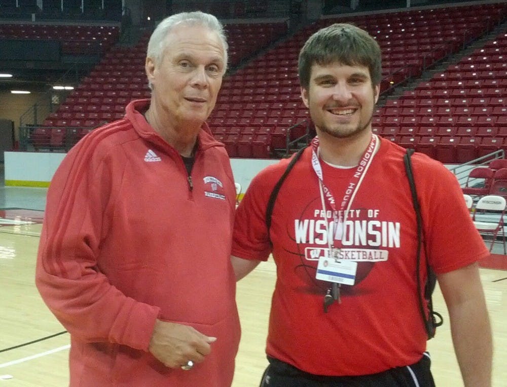 Jack Doherty, Bo Ryan’s stunt double, poses at the Kohl Center with a very easily convinced UW-Madison student.