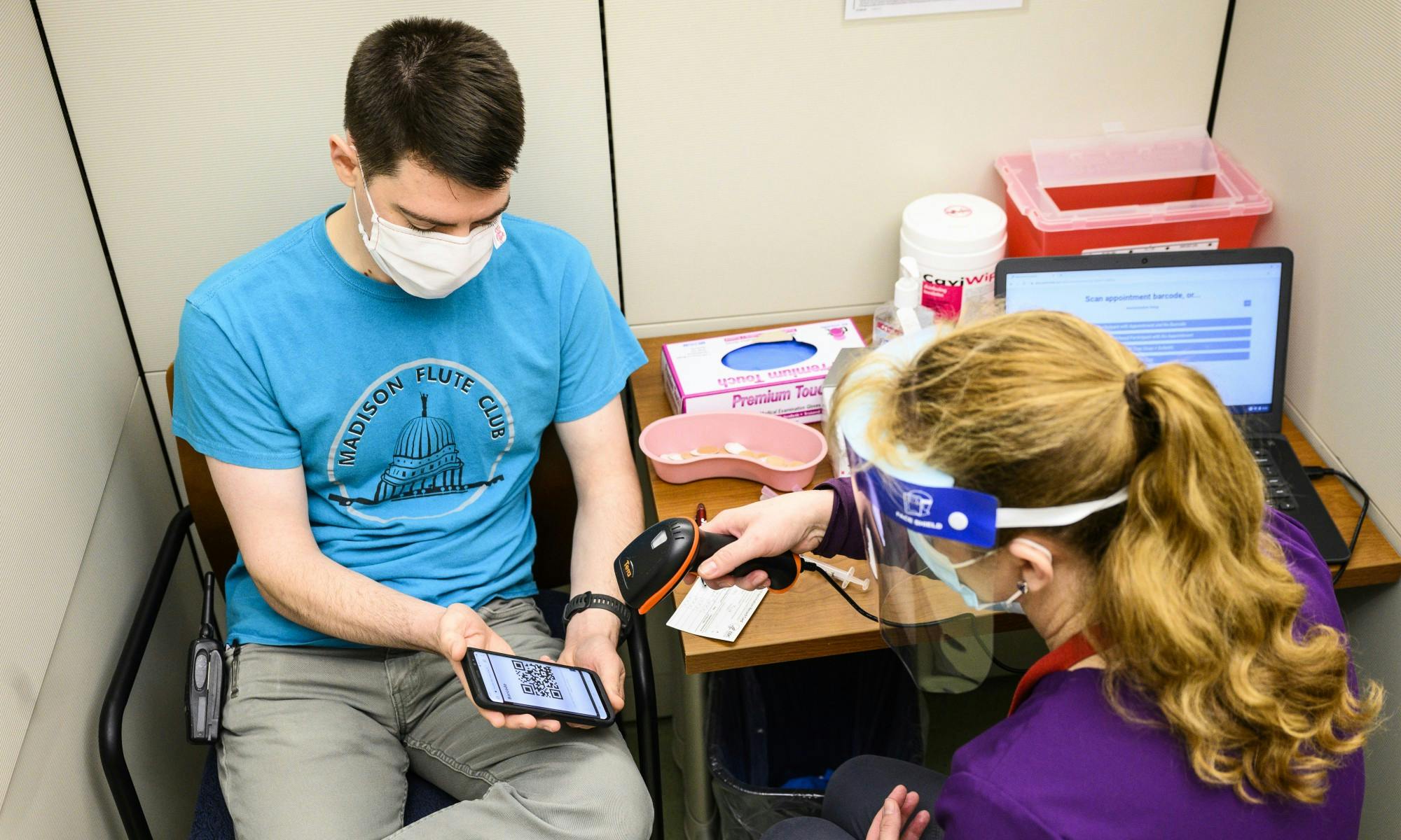 University employee prepares to get Covid-19 vaccine.