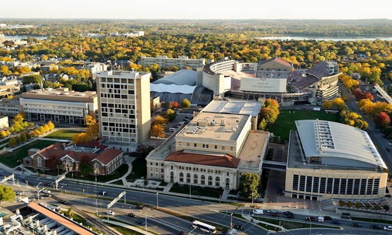 The engineering campus at the University of Wisconsin-Madison is pictured in an aerial view during an autumn sunset on Oct. 5, 2011. Clockwise from bottom right is the Engineering Centers Building, Mechanical Engineering Building, Material Science and Engineering Building, Engineering Hall, and Engineering Research Building. In the background is Camp Randall Stadium. The photograph was made from a helicopter looking south. (Photo by Jeff Miller/UW-Madison)
