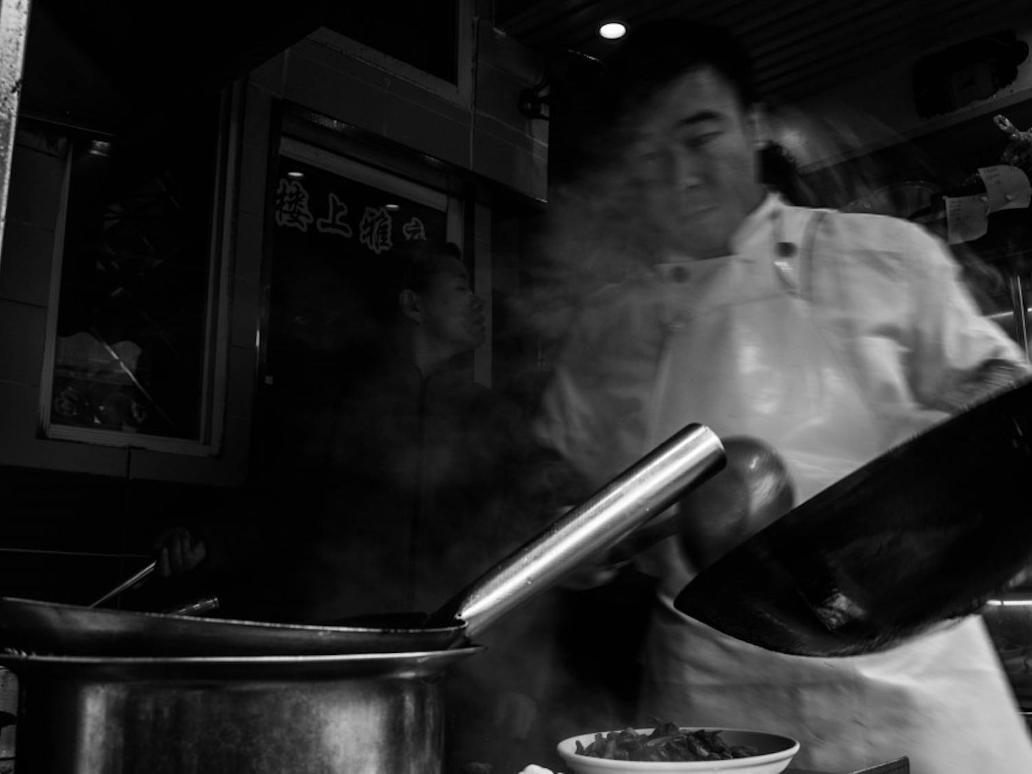10. Man cooking with pan.jpg