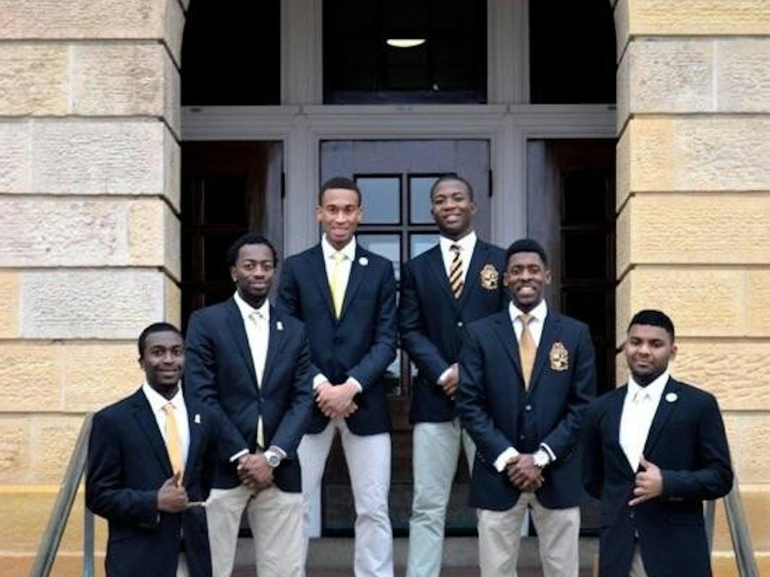 Members of Alpha Phi Alpha, one of seven Black Greek Letter Organizations at UW-Madison, pose outside Bascom Hall.