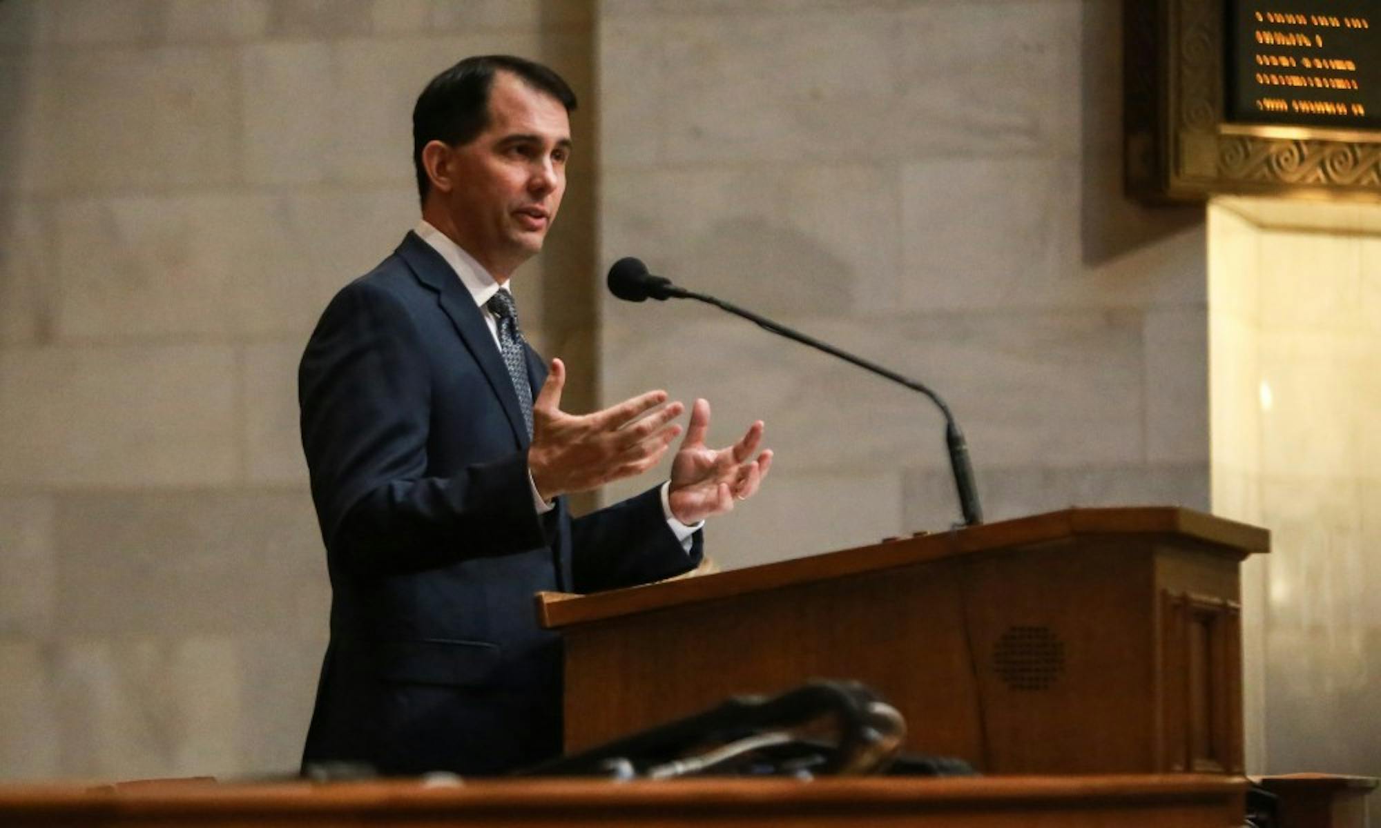 Wisconsin families will soon be eligible to receive a $100 tax credit for every dependent child in the household under a major bill signed into law by Gov. Scott Walker Tuesday.