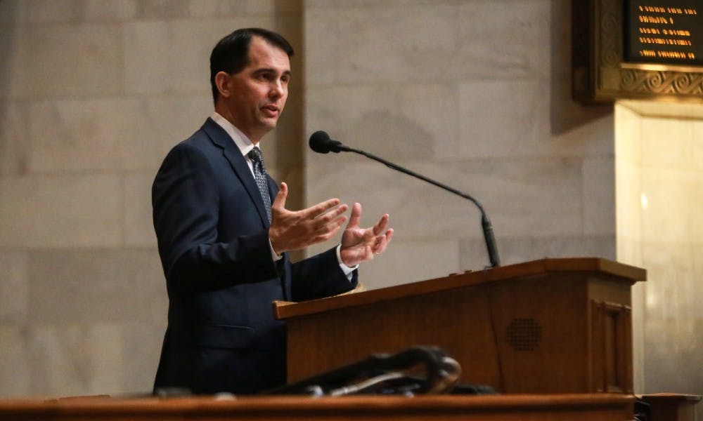 Wisconsin families will soon be eligible to receive a $100 tax credit for every dependent child in the household under a major bill signed into law by Gov. Scott Walker Tuesday.