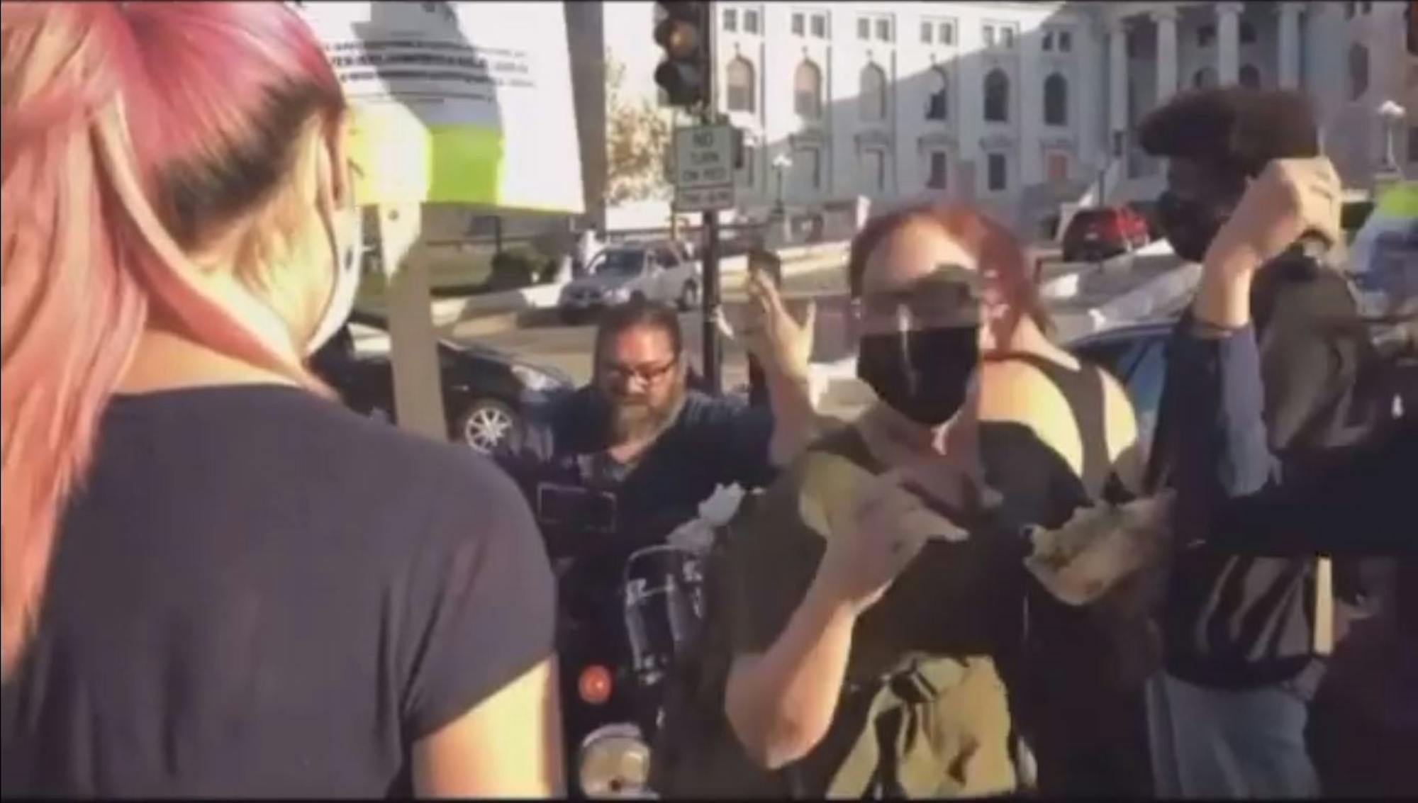 lowQualityBikerRiderGoingThroughProtest.JPG