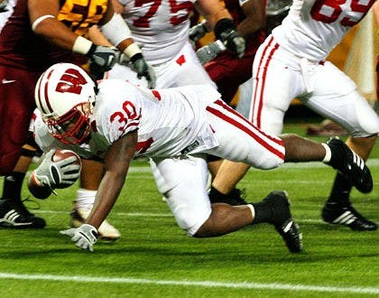 Badgers retain Axe, down Gophers 41-34