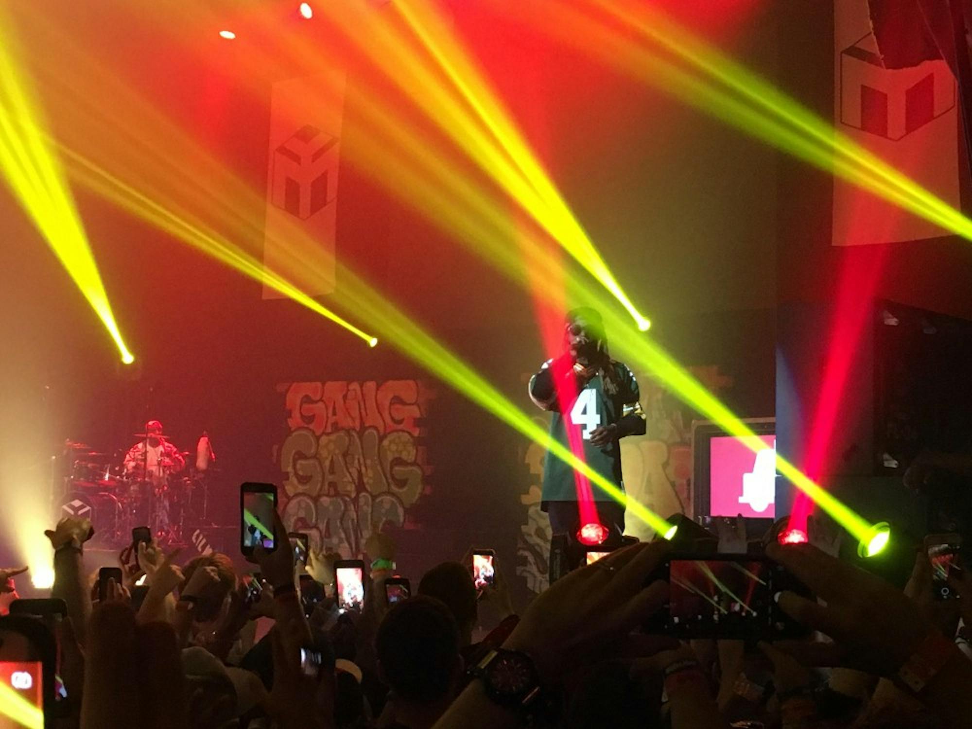 Wearing a customized Favre jersey, Lil Wayne performed classic tracks during the sold-out show.