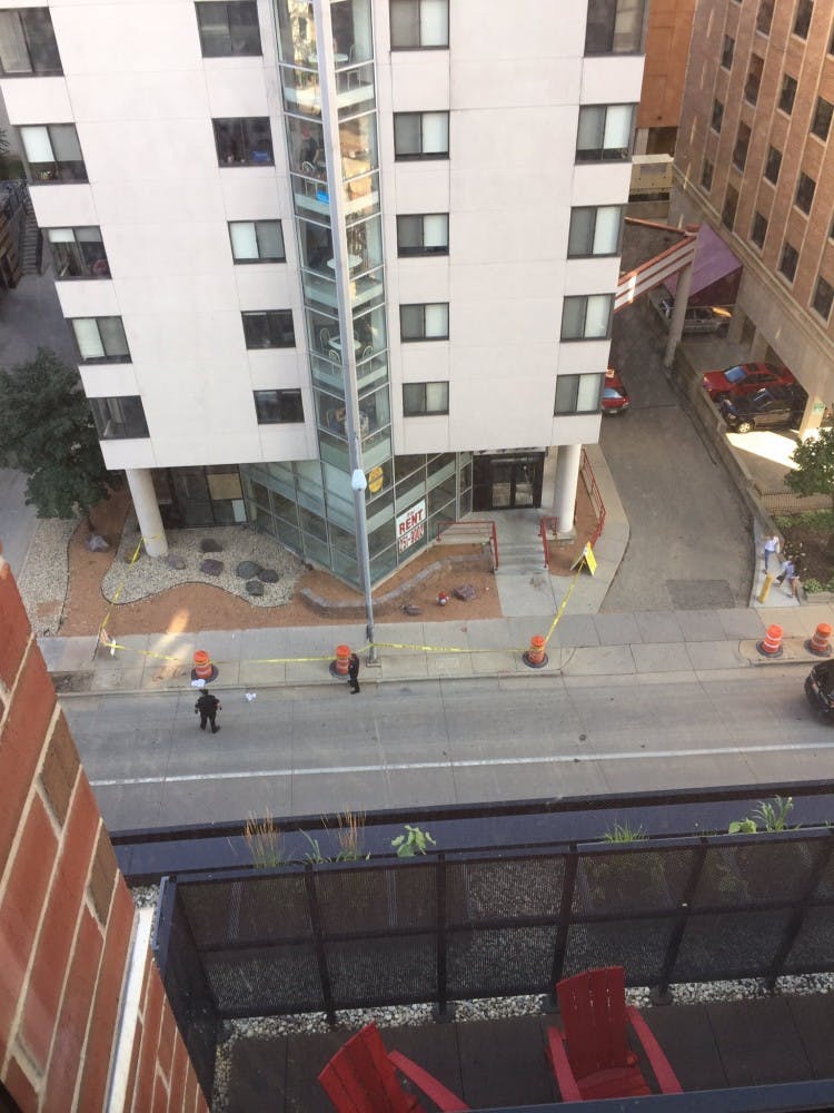 The La Ville apartment complex was roped off after an incident Monday in which two people were injured.