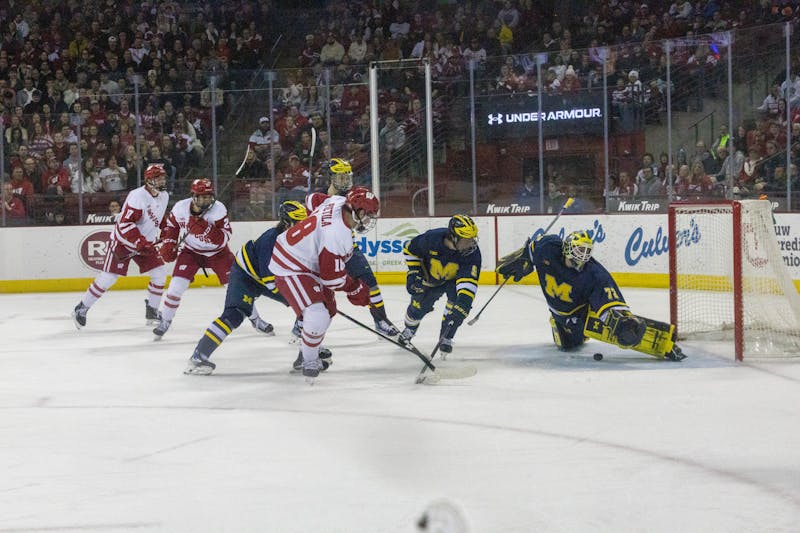 Wisconsin splits with No. 2 Michigan to keep tourney hopes afloat