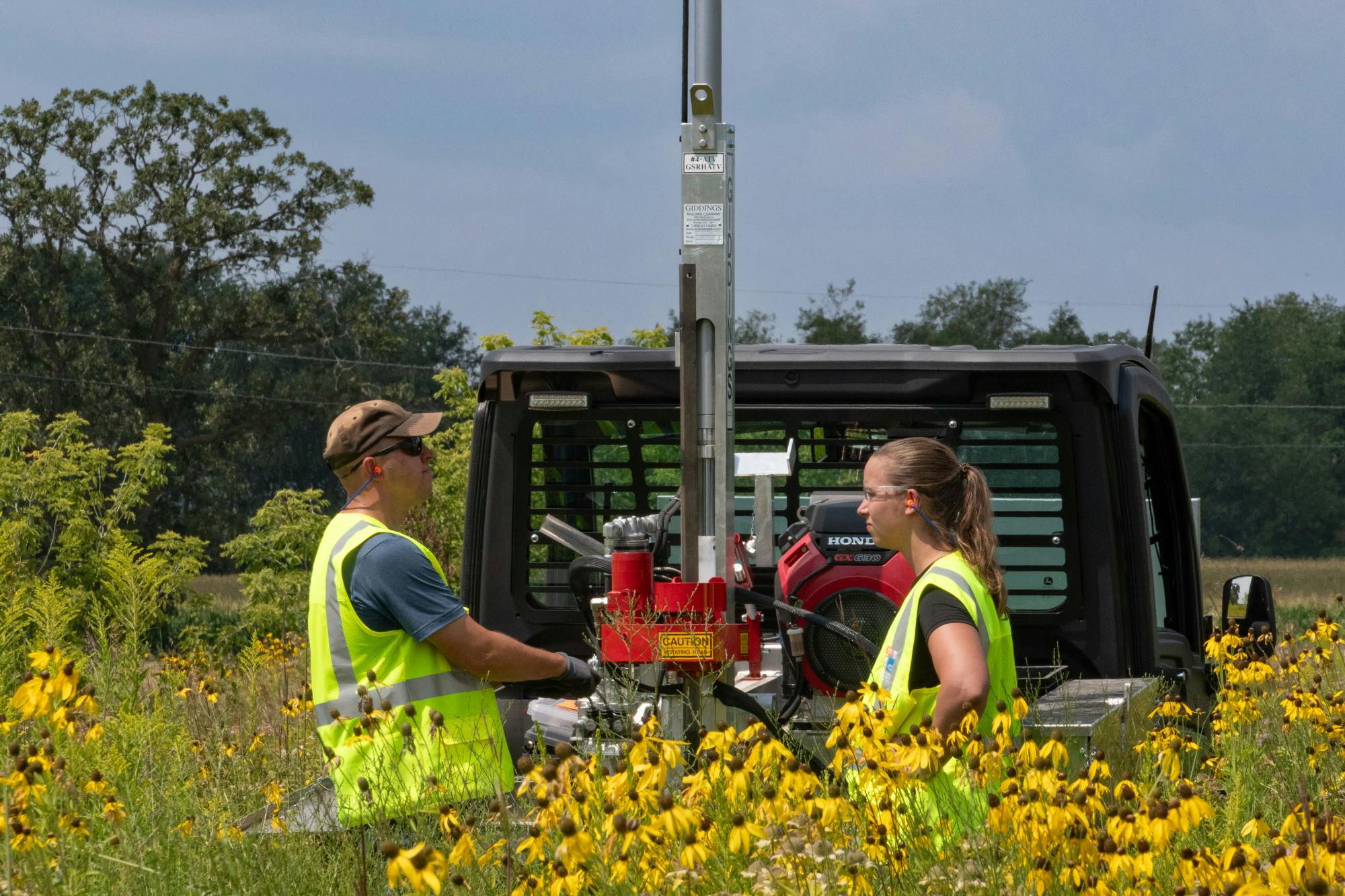 The team of James Brodzeller and Alex Coxhead work to take soil carbon samples at Anderson Farm County Park