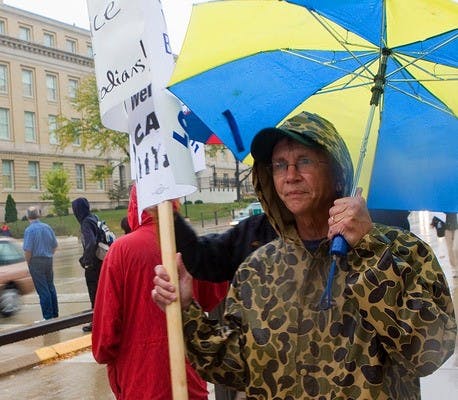 Custodians picket against extension of new third shift hours