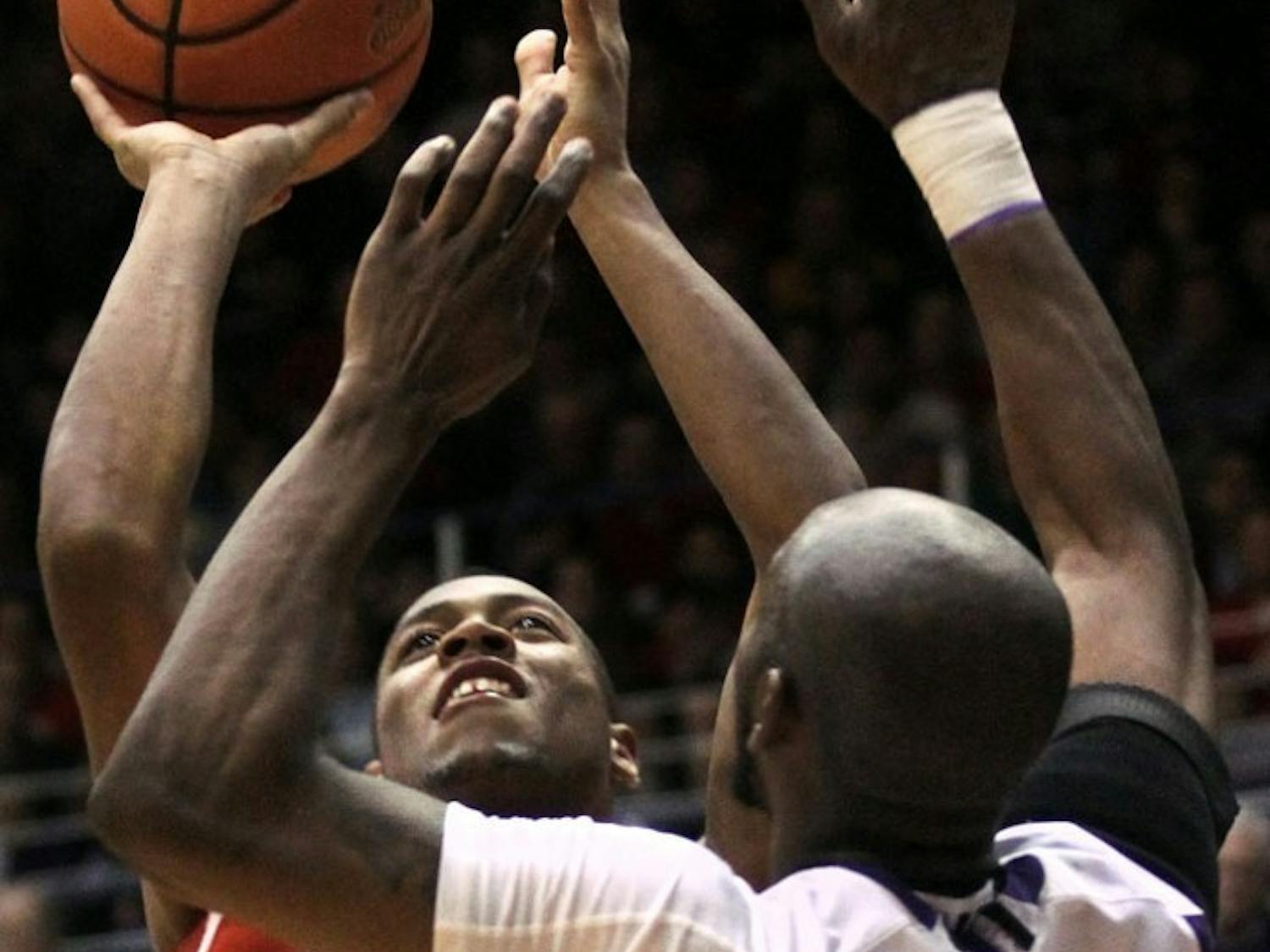 Hughes' clutch scoring pulls Leuer-less Badgers past Wildcats