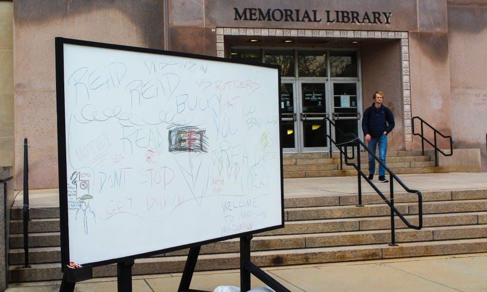 An interactive art installation meant to promote public discourse was temporarily established in front of Memorial Library Thursday. 