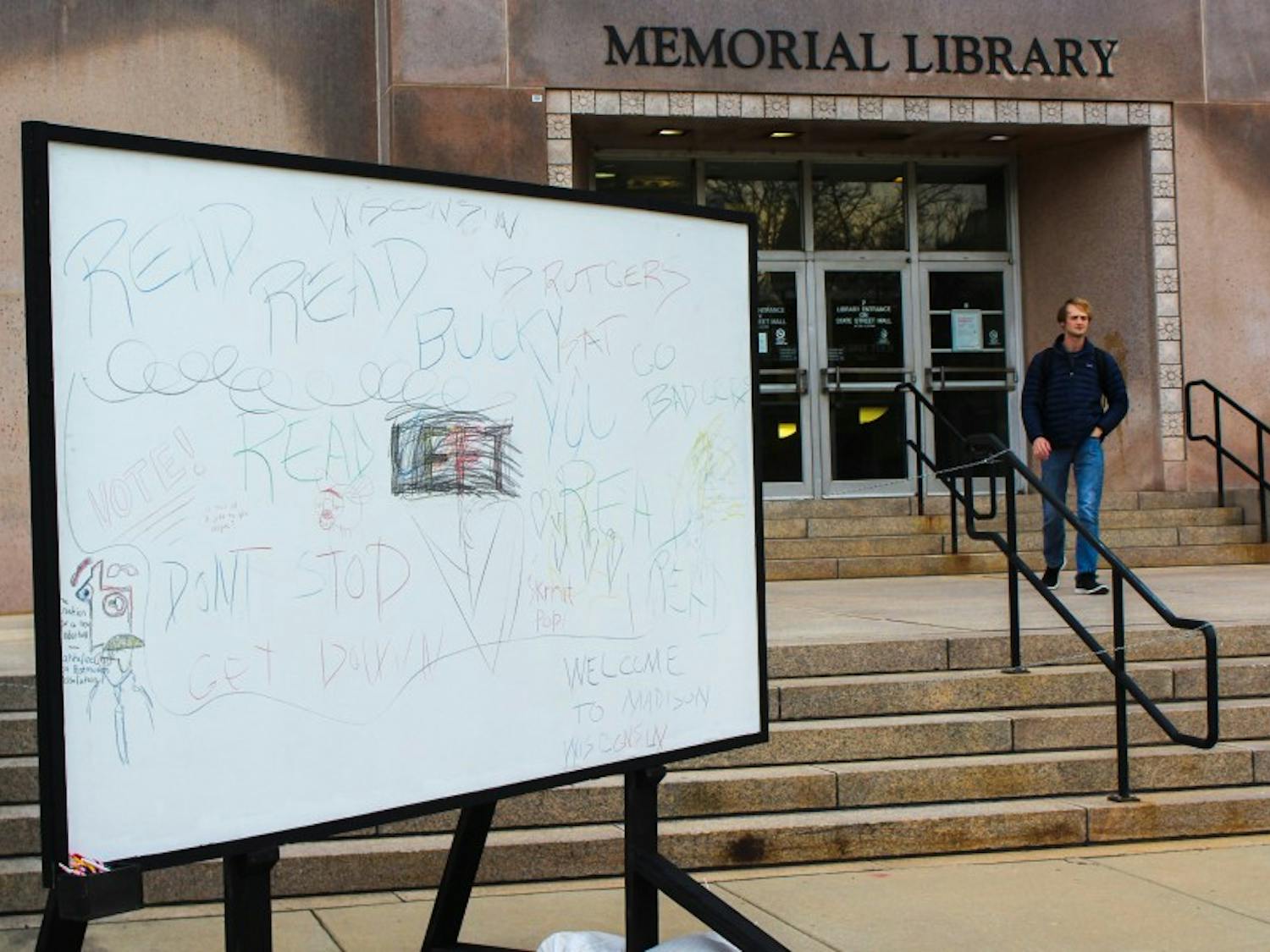 An interactive art installation meant to promote public discourse was temporarily established in front of Memorial Library Thursday.