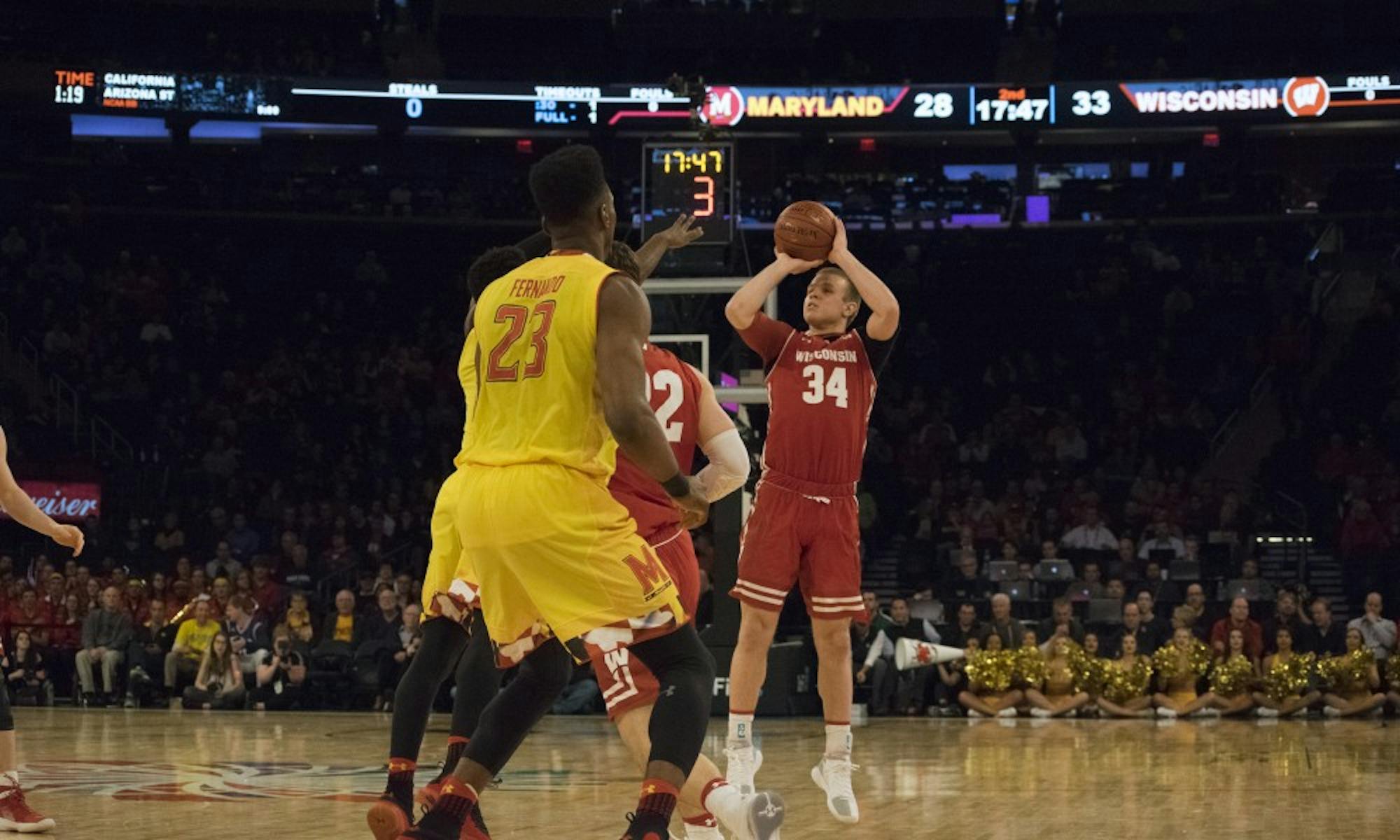 Brad Davison scored 13 points as Wisconsin advanced past Maryland, 59-54.