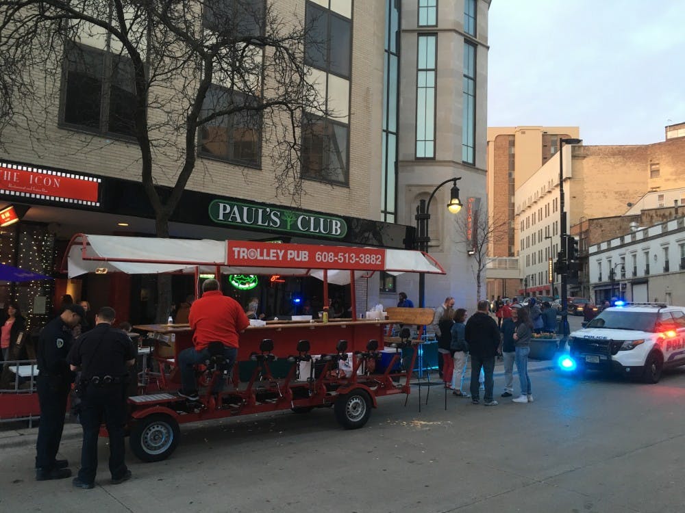 Three people sustained minor injuries after a city bus collided with a Trolley Pub Friday on State Street.