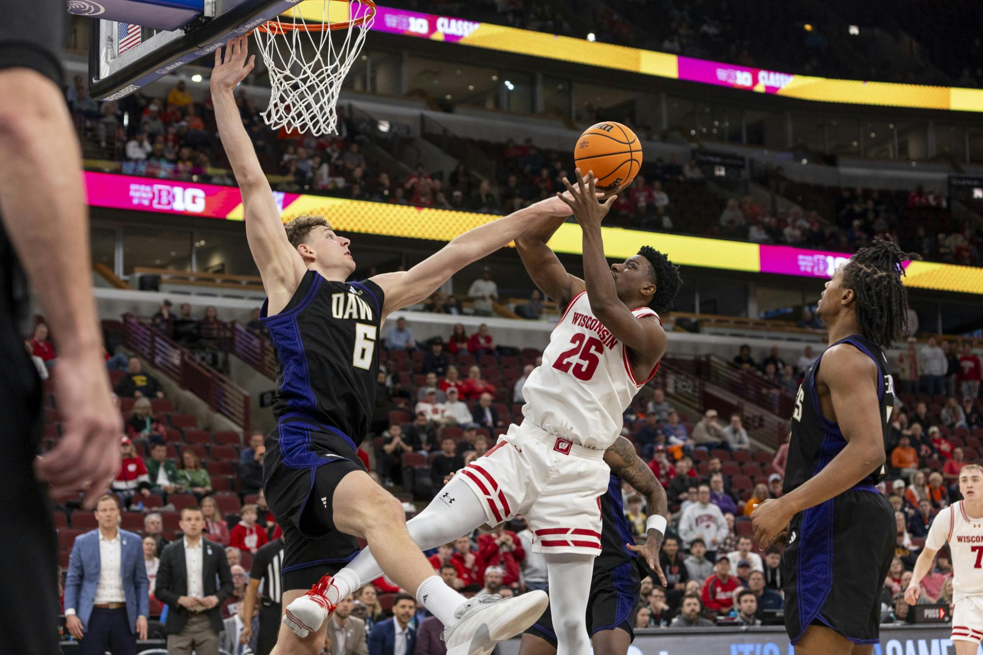 PHOTOS: The Wisconsin Badgers men's basketball team narrowly advanced to the quarterfinals of the Big Ten Tournament, defeating the Washington Huskies 85-82.