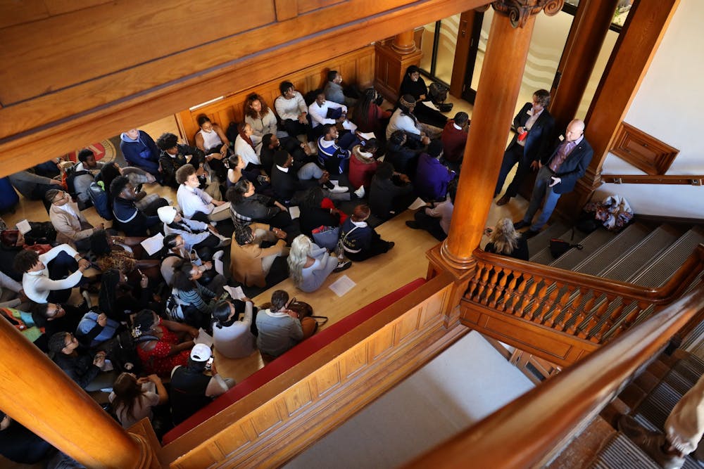 Students are photographed staging a silent sit-in protest inside Bascom Hall on the University of Wisconsin-Madison campus on May 3, 2023. The protesters sat in silence while awaiting the arrival of Chancellor Jennifer Mnookin.