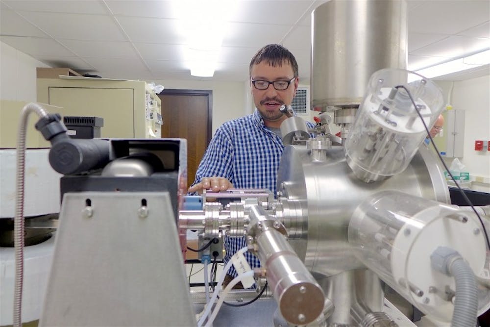 Aaron Satkoski used the UW-Madison Department of Geoscience's mass spectrometer to measure isotopes in samples collected from South Africa.