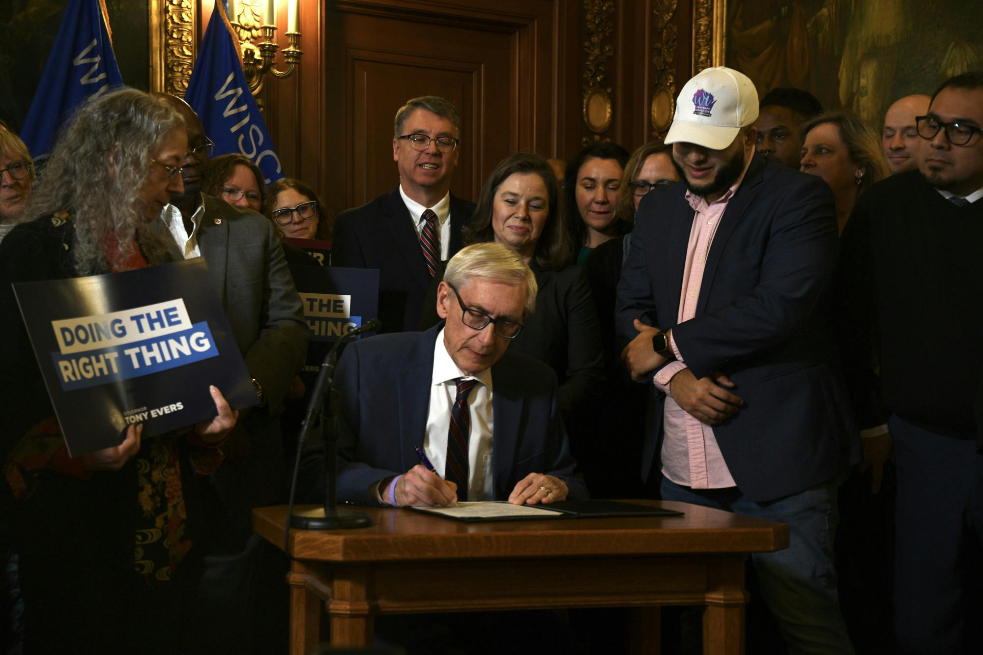 Gov Tony Evers signs