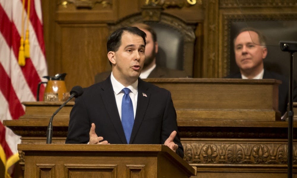 Gov. Scott Walker said he will cut tuition for in-state students at UW System schools.