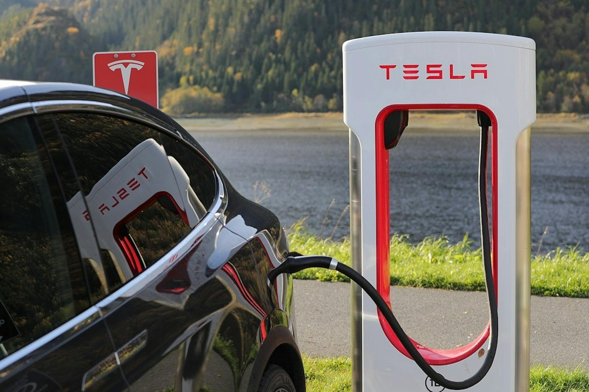 A Tesla Model 3 charges at a Tesla charging station. Photo by Creative Commons.