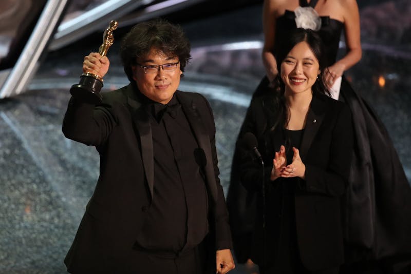 Bong John Ho and his interpreter accept one of the four awards he took home. 