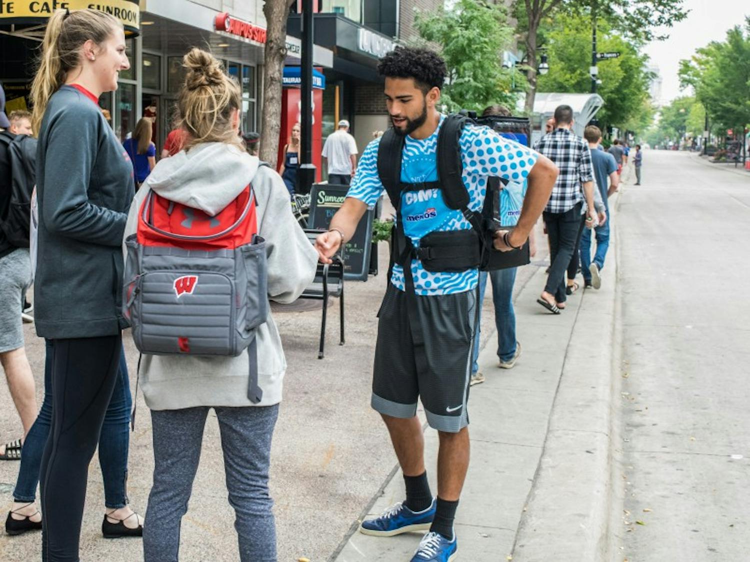 UW-Madison freshman Sam Jeschke successfully finished handing out 43,000 bottles of gum to the campus community Tuesday night at Camp Randall.