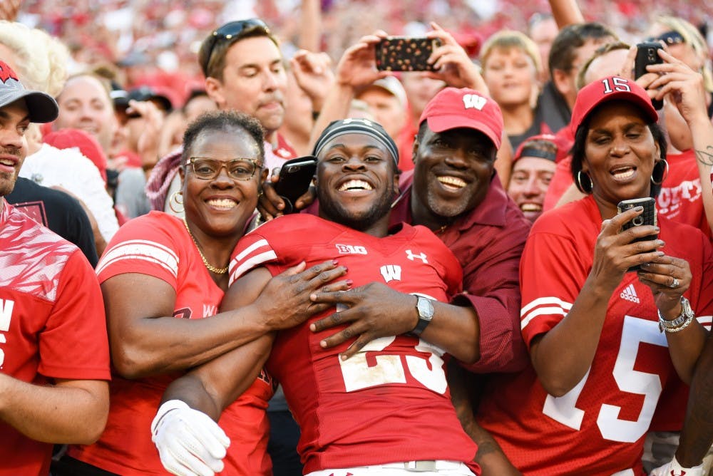 Ogunbowale with his family after the Badgers knocked off LSU at Lambeau Field.&nbsp;