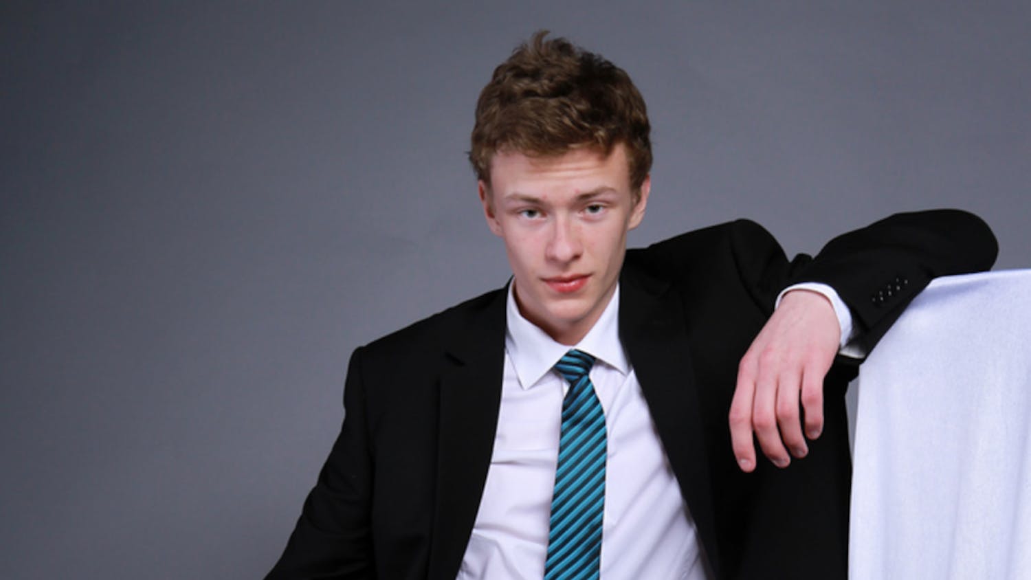 Incoming junior Nick Rinaldi contemptuously looks over his underdressed classmates, many of whom sport sneakers.