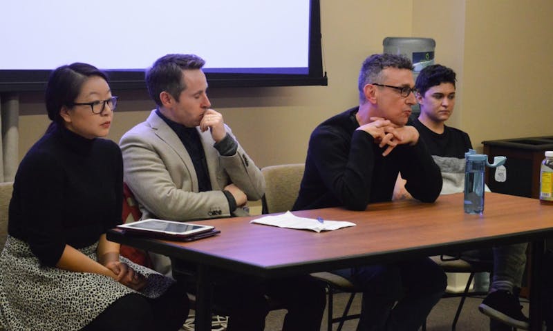 Graduate students Wendy Li and CV Vitolo-Haddad, along with professors Don Moynihan and Robert Asen, spoke as part of a panel discussion about the grad student tax increase Wednesday.