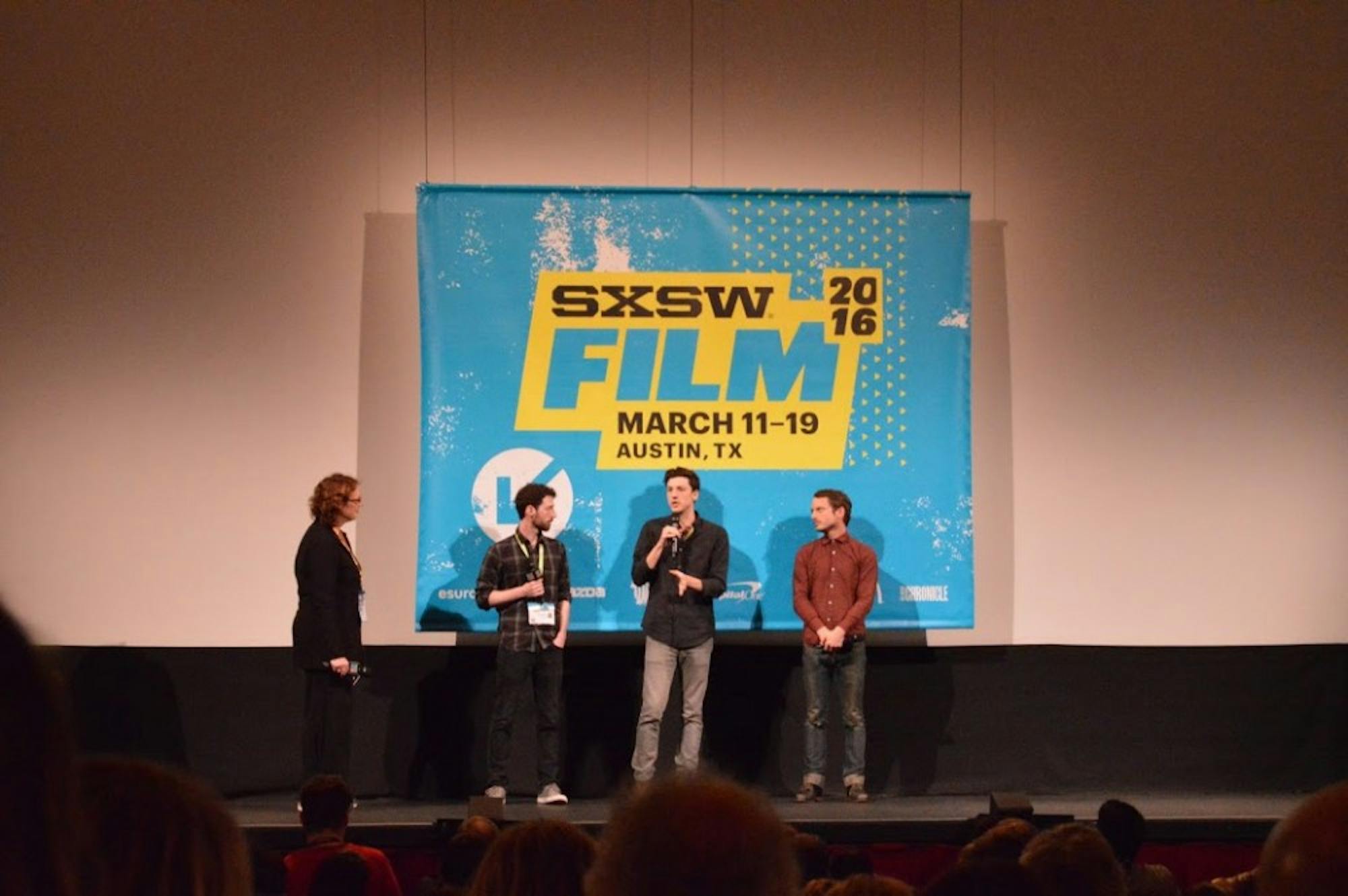 Elijah Wood talks with&nbsp;first-time&nbsp;directors after the screening of their film 'The Trust.'