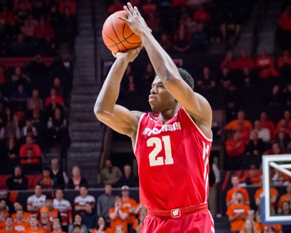 Wisconsin's Khalil Iverson (21) shoots a three during the game against Illinois at State Farm Center on Tuesday, January 31.