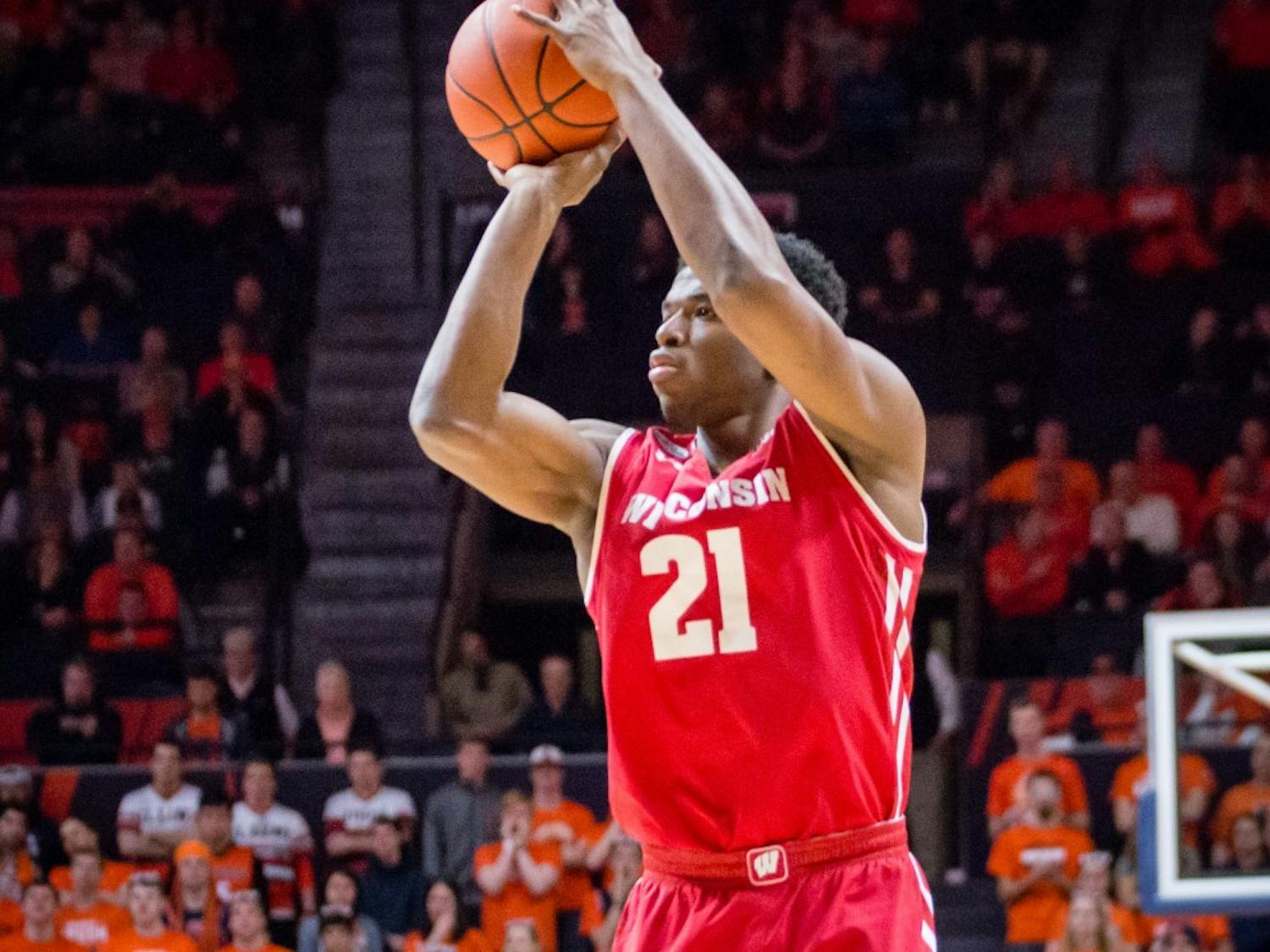 Wisconsin's Khalil Iverson (21) shoots a three during the game against Illinois at State Farm Center on Tuesday, January 31.