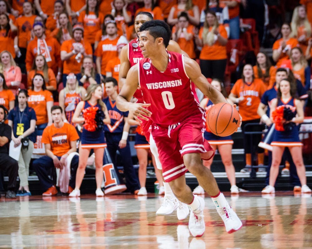 Wisconsin's D'Mitrik Trice (0) brings the ball down the court during the game against Illinois at State Farm Center on Tuesday, January 31.