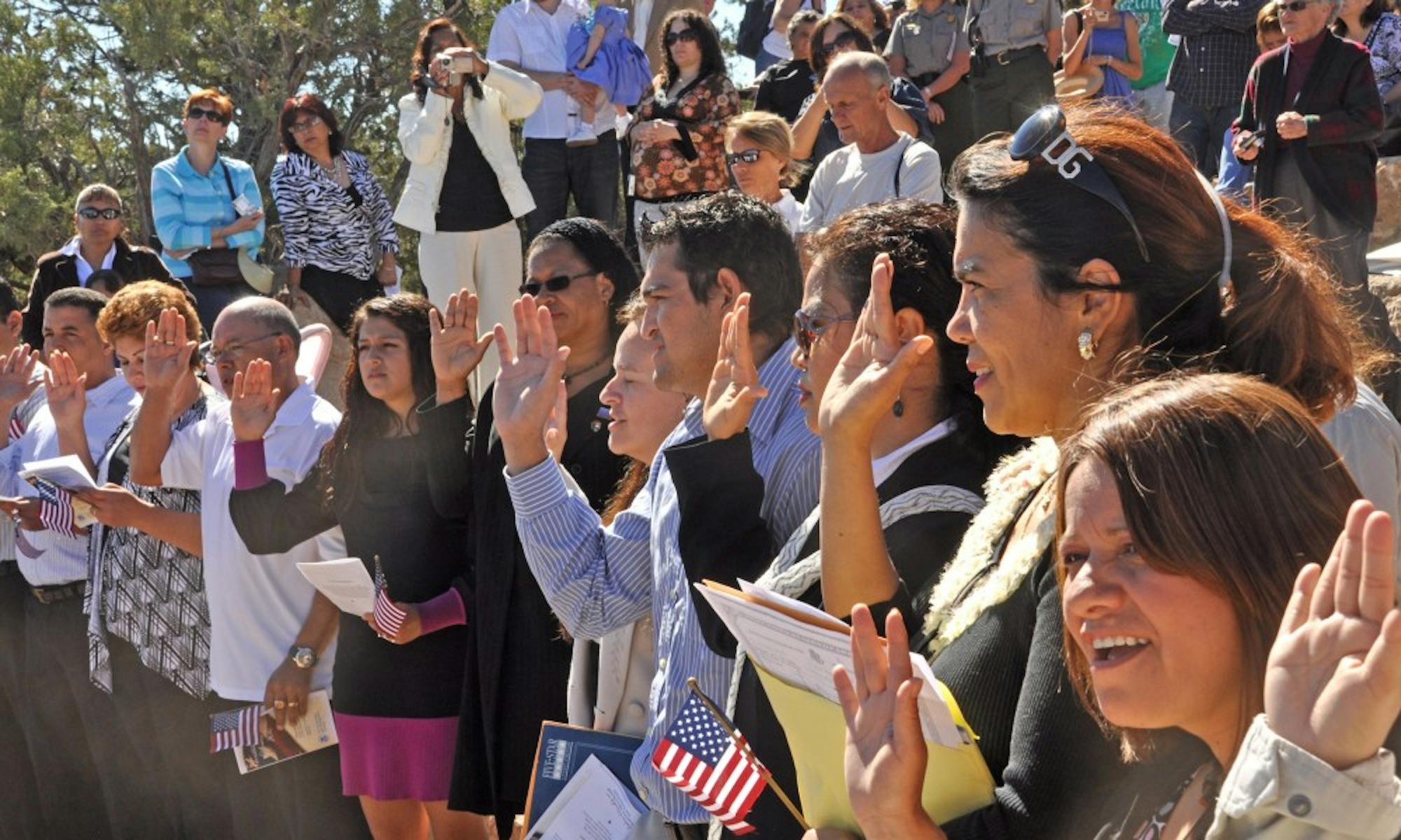 On Thursday, September 23, Grand Canyon National Park in coordination with The Department of Homeland Security, hosted a naturalization ceremony at the Mather Amphitheatre on the South Rim. This is the first time in history that Grand Canyon National Park has hosted such an event.

 Under blue skies and before a breathtaking view, 23 individuals from 12 different countries including, Colombia, Dominican Republic, Guatemala, Japan, Mexico, Morocco, Australia, Trinidad and Tobago, Uruguay, Venezuela, Vietnam and Zambia, became naturalized citizens. Many family members and close friends of the candidates came to show their support for this special event. Park employees and visitors also watched on as the candidates stated the Oath of Allegiance, and received their certificates of naturalization. 

Deputy Superintendent Palma Wilson welcomed the candidates and their families.  The Presentation of Colors was done by the Air Force ROTC Honor Guard of Northern Arizona University. John M. Ramirez, Acting District Director for the U.S. Citizenship and Immigration Services (USCIS) administered the Oath of Allegiance to America's newest citizens.  A keynote address was given by USCIS Ombudsman January Contreras. Ms. Contreras stated, ìEveryday, we welcome new and diverse stories and heritages into the great patchwork of our Nation. United by our devotion to the Constitution and to the civic engagement it inspires, Americans remain committed to the fundamental principles established over two hundred years ago.î

This event is part of USCISís annual celebration of Constitution Day and Citizenship Day. An estimated 9,258 candidates will become citizens at 63 special ceremonies held across the country and around the world from Sept. 13-24.

Constitution Day is celebrated on Sept. 17 in remembrance of the signing of the Constitution in 1787. Since 1952, Citizenship Day has been celebrated in conjunction with Constitution Day, although Congress first underscored the signific