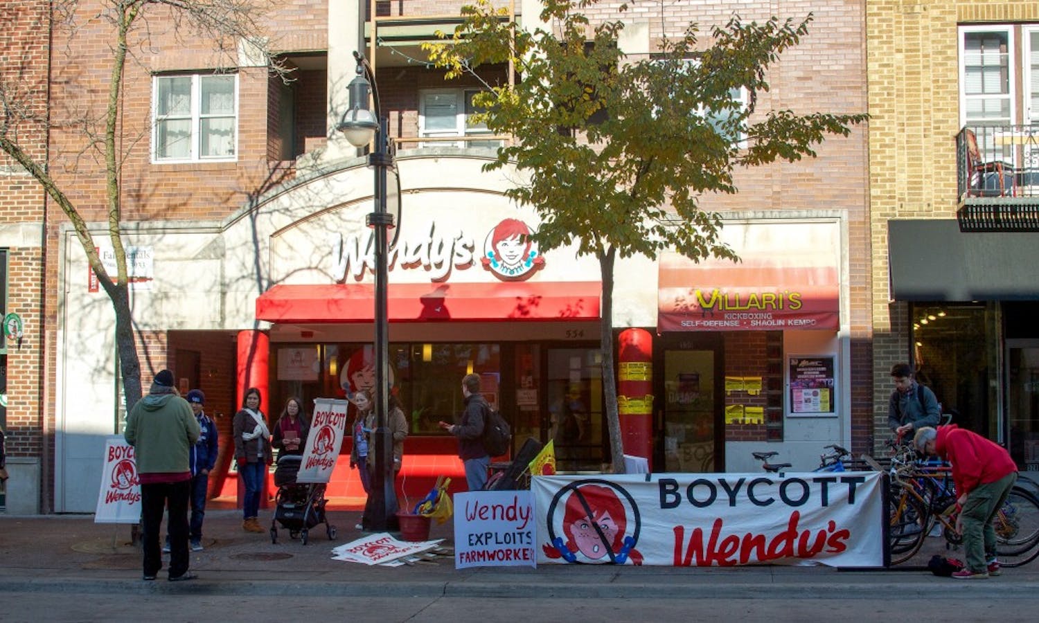 Members of UW-Madison student organization MEChA and community members boycott Wendy’s at  its State Street location Tuesday.