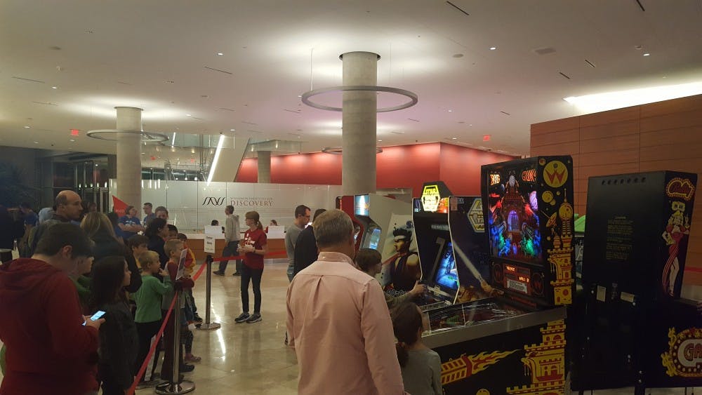 The Science Festival at the Wisconsin Institute for Discovery featured an array of vintage arcade style games that offered an opportunity for attendees of all ages to learn about science.