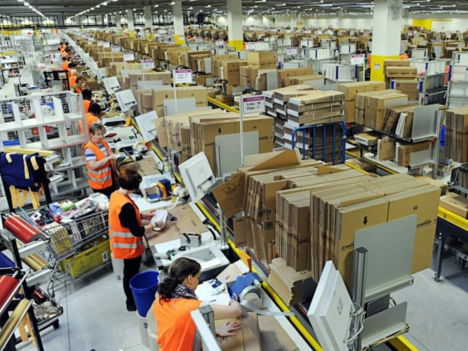 Photo of workers in an Amazon warehouse.