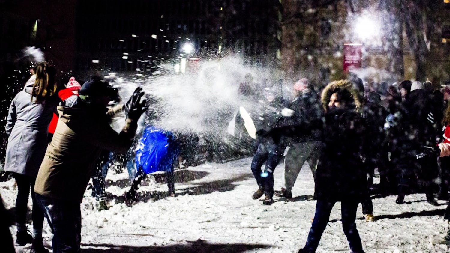 Current and former residents of the Lakeshore and Southeast neighborhoods faced off on Bascom Hill in the annual Battle for Bascom snowball fight.