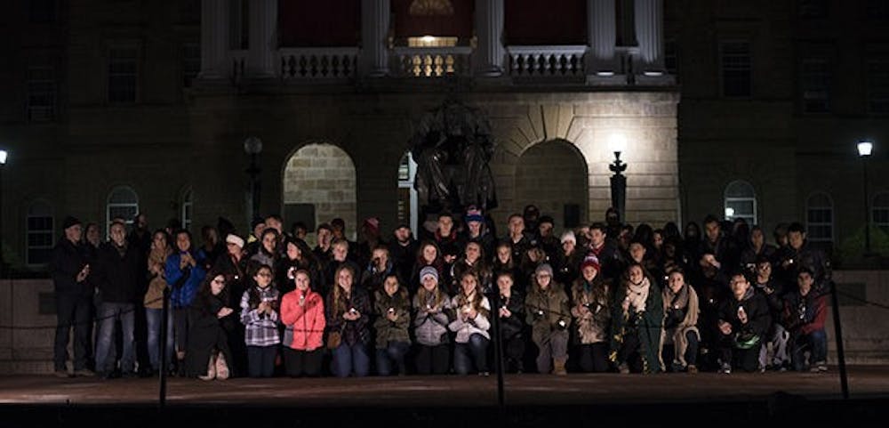 Students at UW-Madison gathered on Bascom Hill in mourning of the recent terrorist attacks in Paris. This display of solidarity stands in contrast to the political commentary and bashing that has become common.