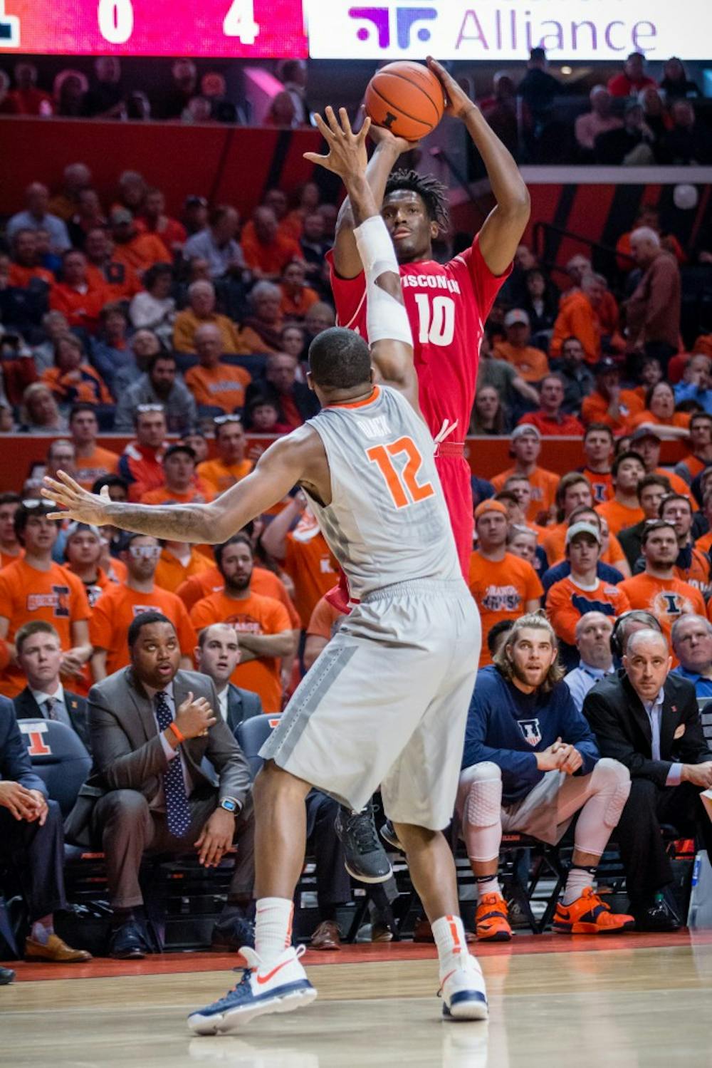 Wisconsin's Nigel Hayes (10) shoots a three over Illinois' Leron Black (12) during the game at State Farm Center on Tuesday, January 31.