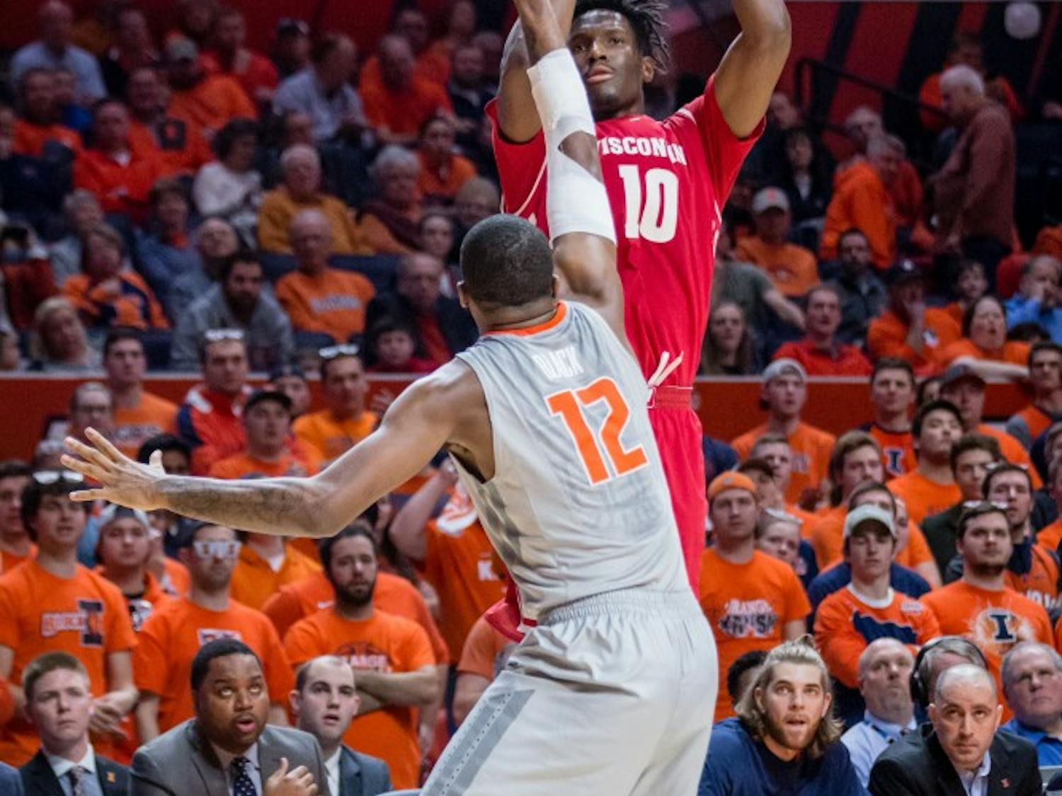 Wisconsin's Nigel Hayes (10) shoots a three over Illinois' Leron Black (12) during the game at State Farm Center on Tuesday, January 31.