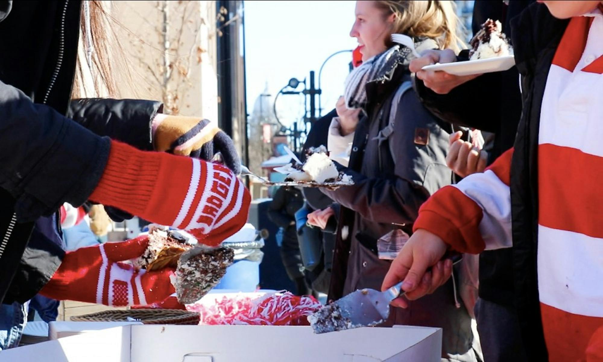 Members of the Wisconsin Alumni Student Board offered free cake and hot chocolate to students Friday to celebrate 168 years of UW-Madison classes on Founder’s Day.