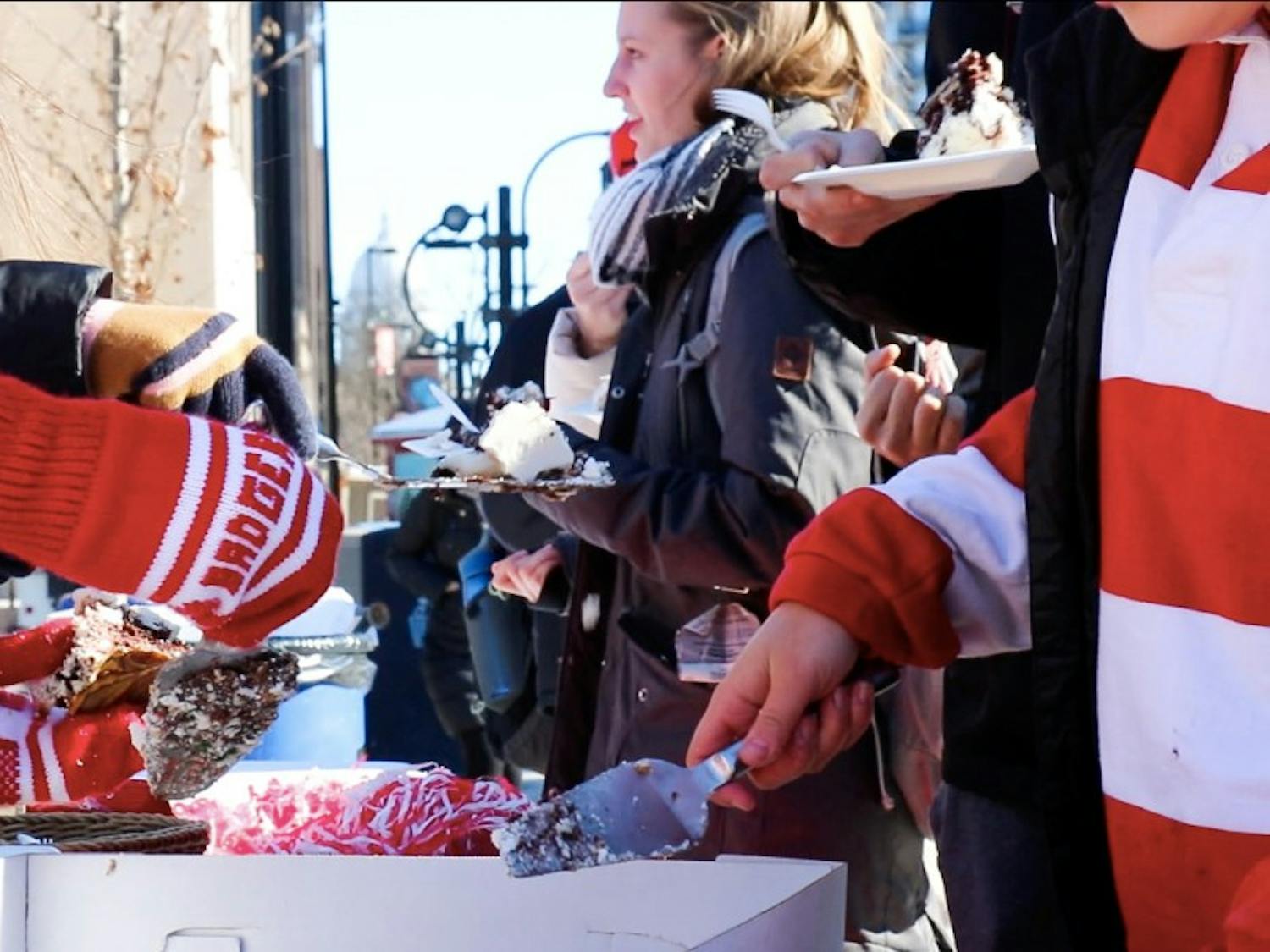 Members of the Wisconsin Alumni Student Board offered free cake and hot chocolate to students Friday to celebrate 168 years of UW-Madison classes on Founder’s Day.